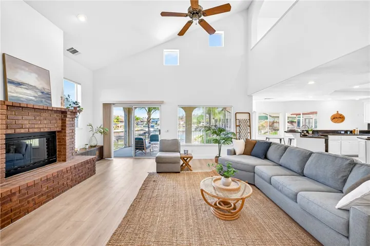 Soaring ceilings, abundant natural light, and panoramic lake views create a truly breathtaking great room.