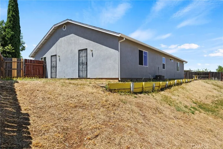 Rear of home and side yard.