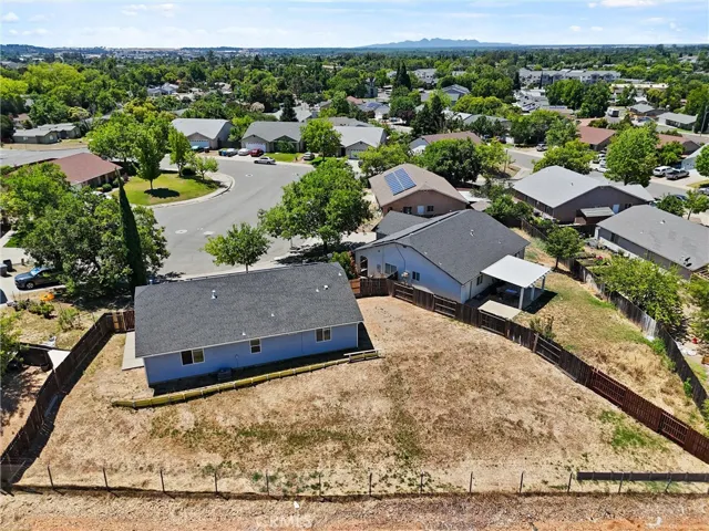 Rear of home backyard overview.