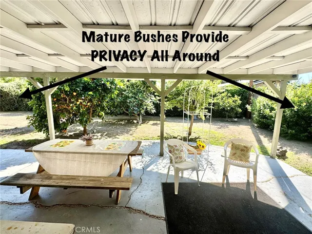 MATURE GREENERY PROVIDE ALL AROUND PRIVACY OF THE BACKYARD.