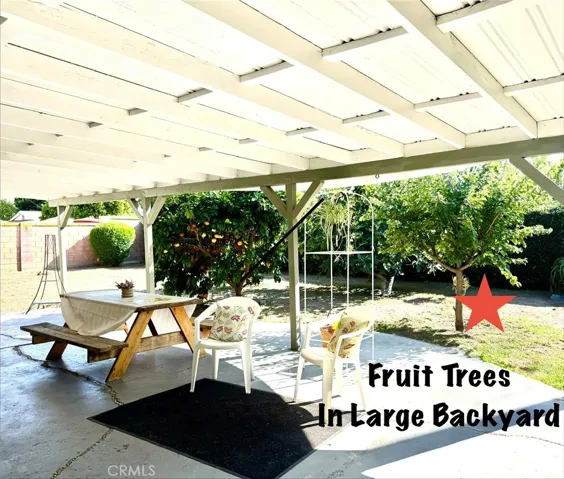 FRUIT TREES IN LARGE BACK AND SIDE YARD.