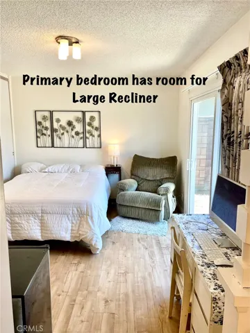 Primary Bedroom has room for Large recliner& a Desk.