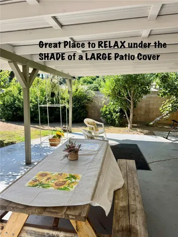 RELAX AND ENJOY UNDER THE LARGE PATIO COVER.