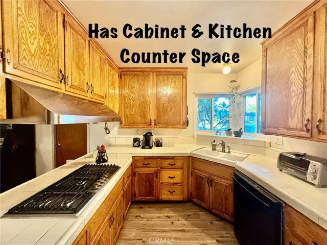 CABINET AND COUNTER SPACE IN KITCHEN.