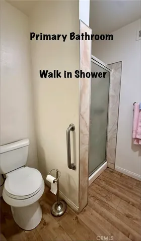 PRIVATE WALK IN SHOWER IN PRIMARY BATHROOM/BEDROOM SUITE.