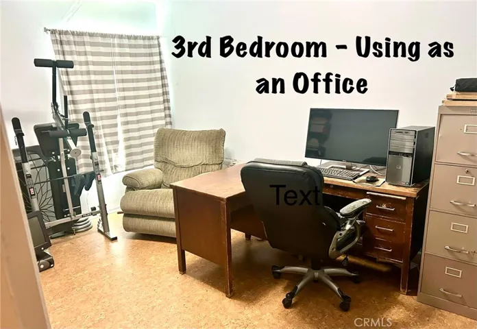 3rd bedroom is being used as an office.