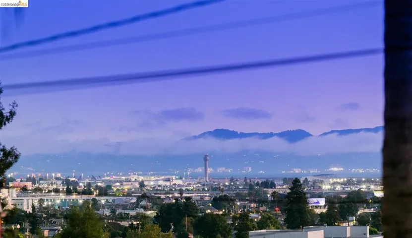 Cityscape with mountain range backdrop