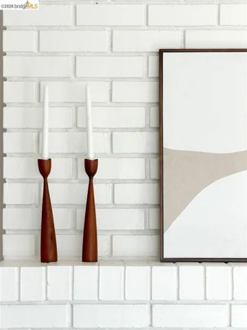 Painted brick fireplace with a flat mantel surface