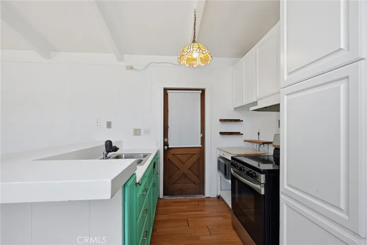 Galley kitchen opens to the carport