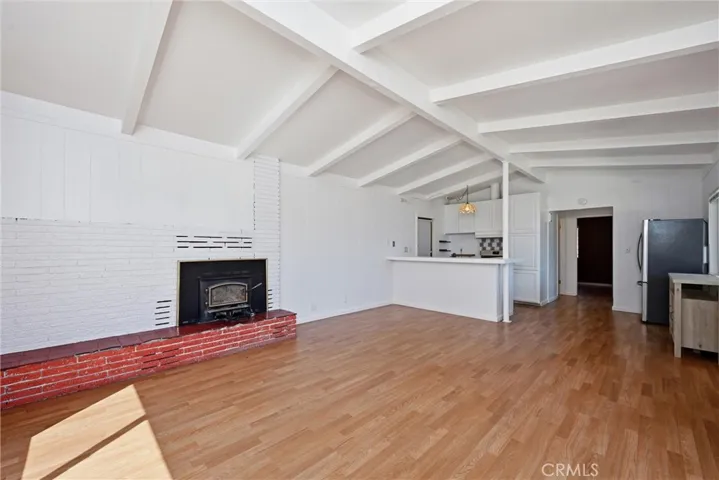 Open floor plan with the kitchen; eat-in counter at the kitchen or set up a dining table with chairs.