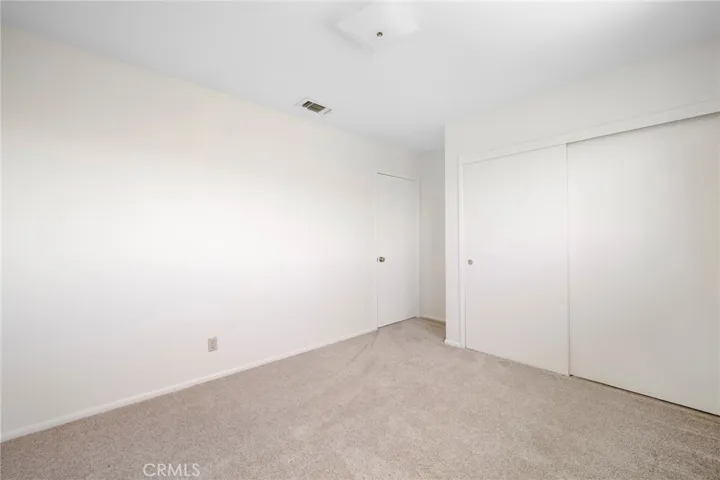 Entry portion of the room, showing the closet.
