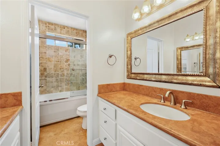 The spacious primary bath serves as a private retreat.