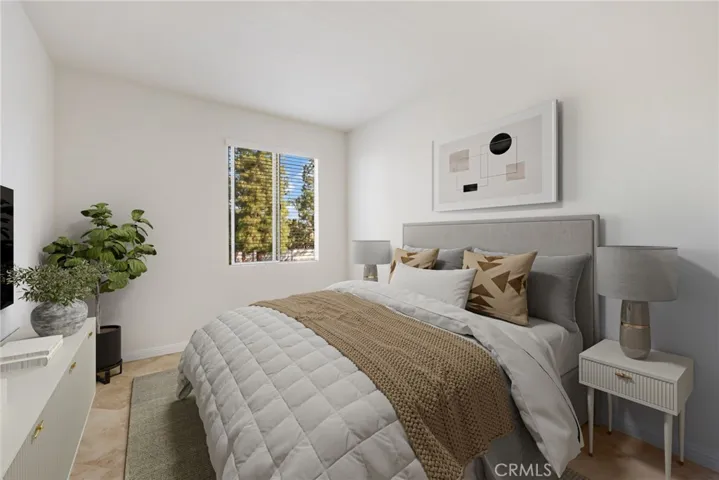Generous walk-in closet in the primary suite. Virtually staged,