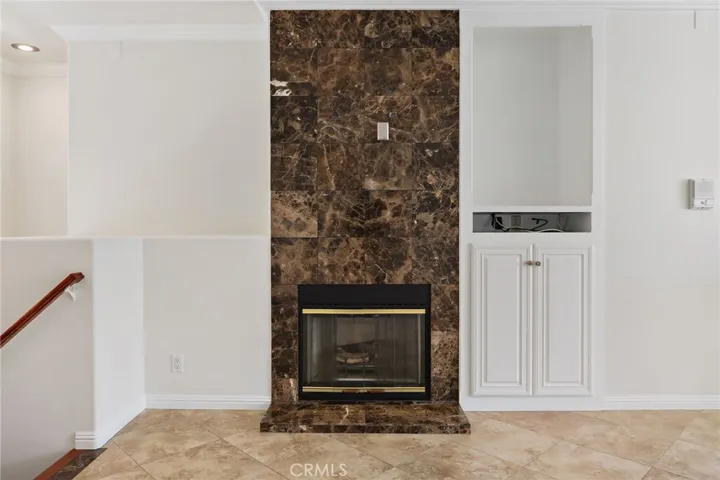 Built-ins surrounding inviting fireplace.