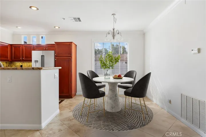 Elegant stone flooring throughout the main living areas. Virtually staged.