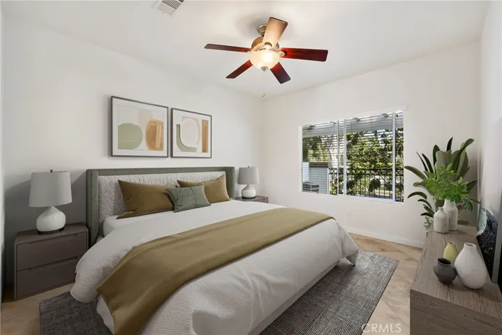 Spacious primary suite offers a peaceful retreat. Virtually staged.