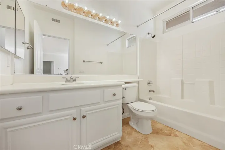 Convenient full bath adjacent to secondary bedroom.