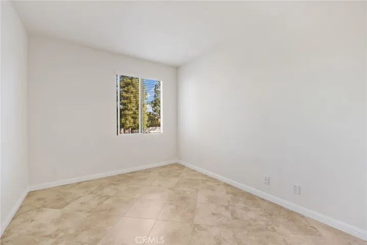 Versatile secondary bedroom for guests or family.