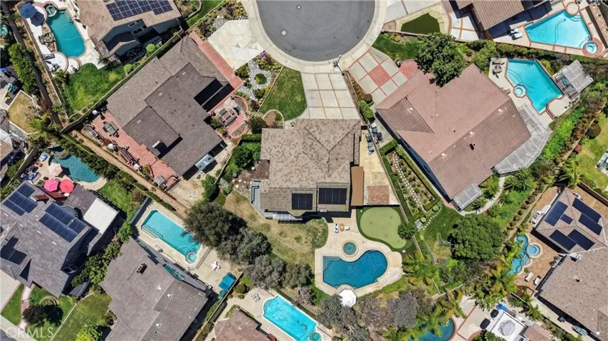 Resort-style backyard featuring a pool, spa, putting green, spacious patio, and gazebo, perfect for entertaining and​​‌​​​​‌​​‌‌​​‌​​​‌‌​​​‌​​‌‌​​‌‌​​‌‌​​​​ relaxing