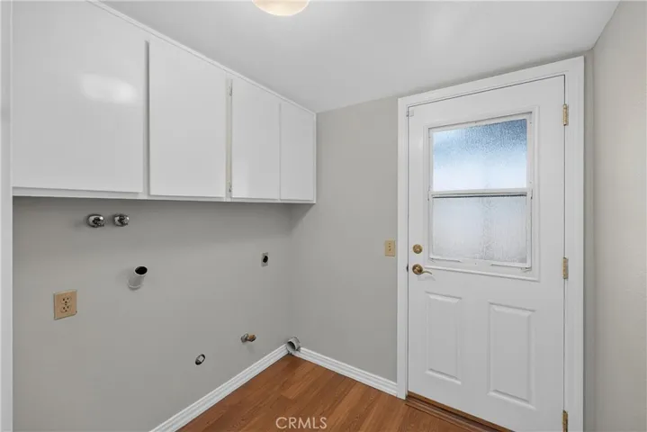 Dedicated laundry room with additional storage