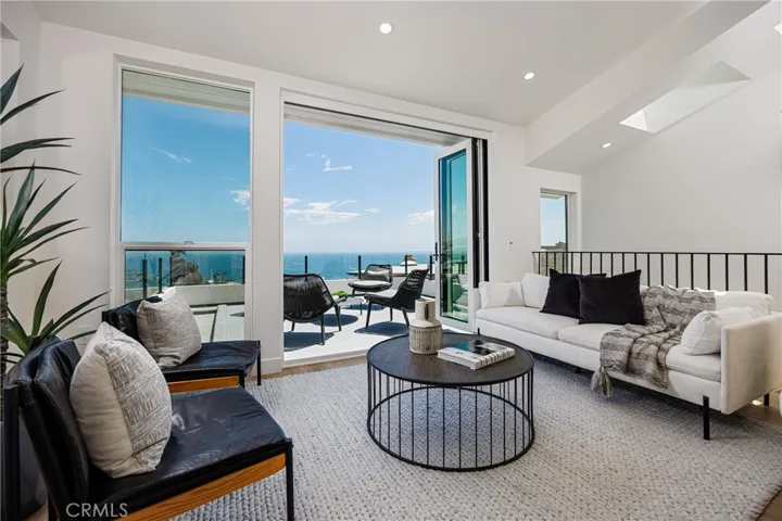 ADU: Living area with large view deck, folding doors