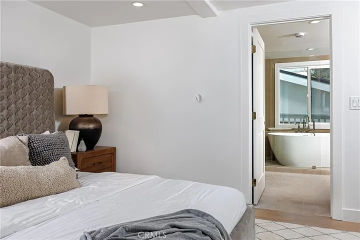 Main house: primary bedroom looking into bath