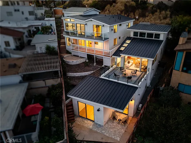 Dusk view of home from ocean side