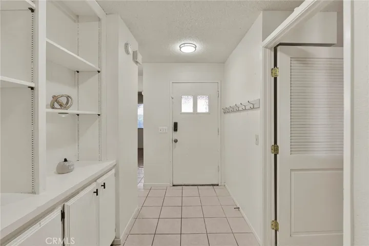 Functional Mud Room type entrance w/ decorative shelving!