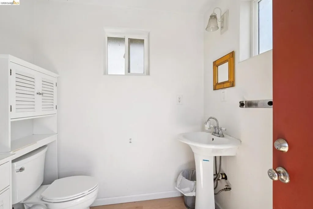 White pedestal sink with chrome faucet hardware