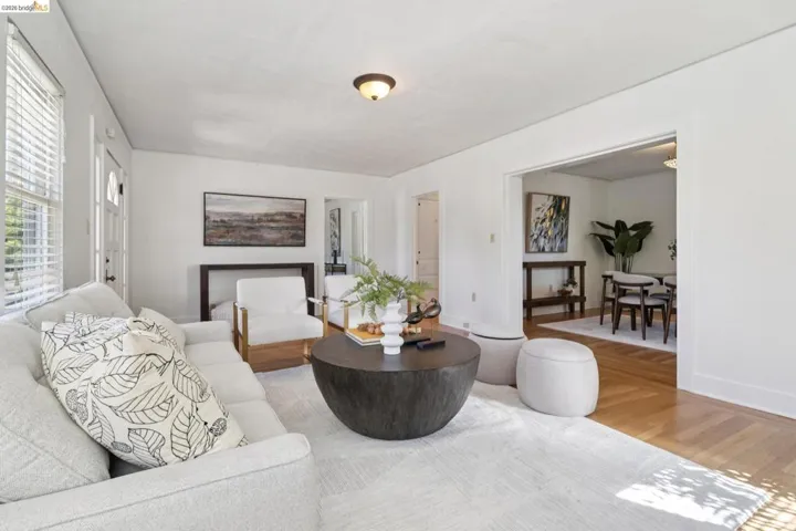 Bright living area featuring light-colored walls and a recessed ceiling light