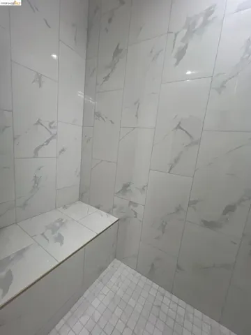 Upstairs Bathroom.  Shower enclosure featuring a built-in bench
