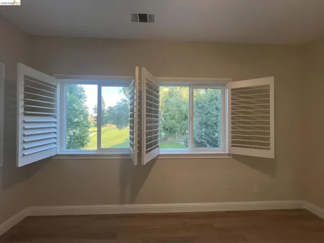 Upstairs. Gorgeous views of golf course.  Two double-hung windows with white plantation shutters