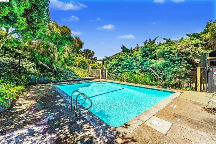 Rectangular swimming pool with integrated metal handrails