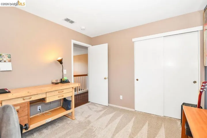 Office featuring light carpet and baseboards