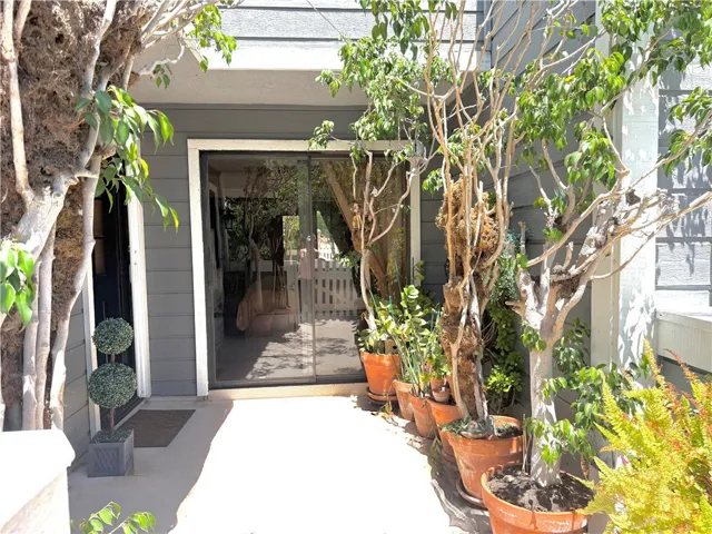 Spacious front patio with two slider windows entering home!