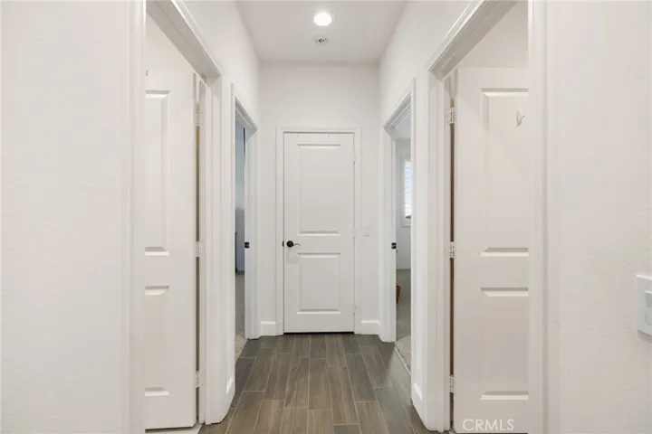 Access to 2 secondary bedrooms, full secondary bath and powder bath
