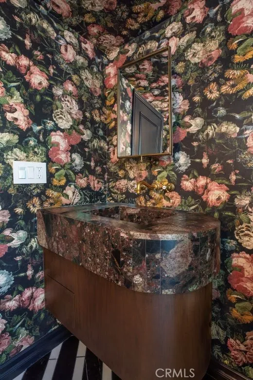 Guest Powder room with outside access to pool.