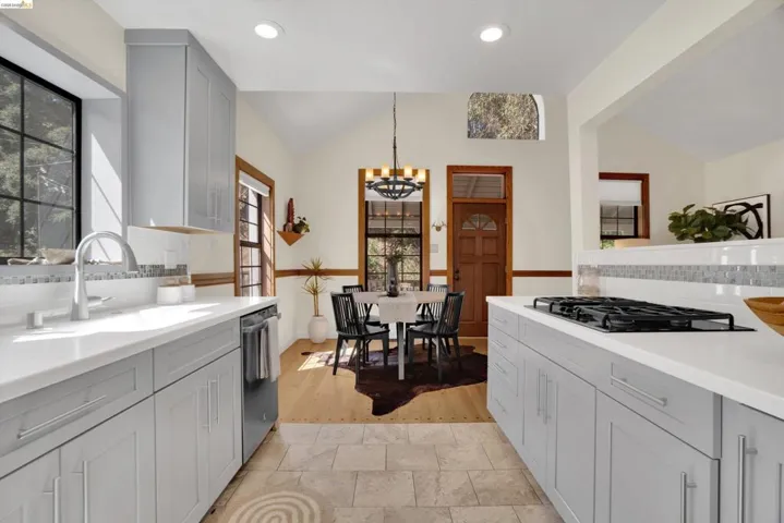 Modern kitchen featuring light gray cabinetry and white countertops