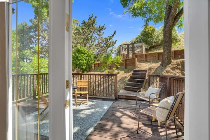 Expansive outdoor deck with wood-finish flooring and railing