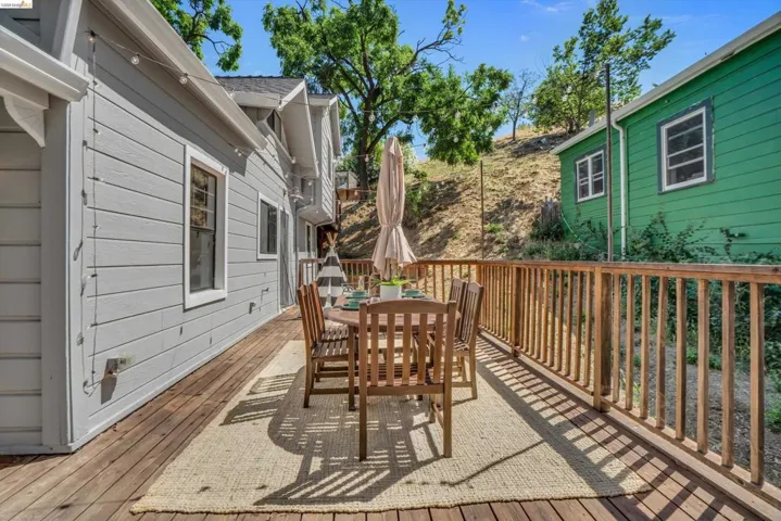 Wood-finish deck with natural wood railing