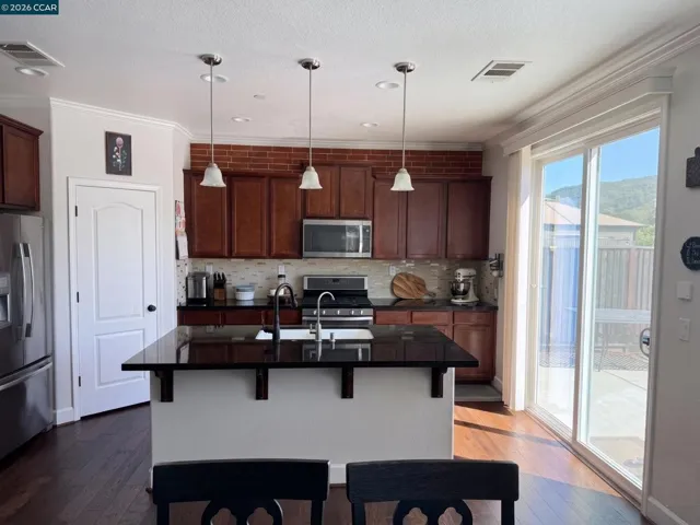 Kitchen with Island and open to Family room
