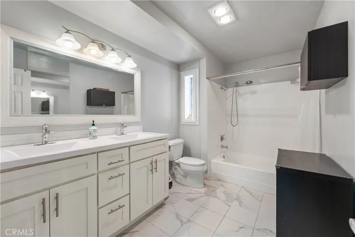 Primary bath with dual vanity.