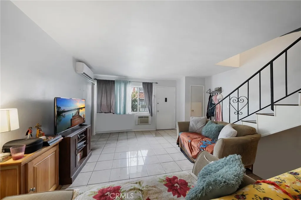 Roomy living area with tile flooring.