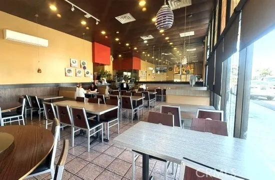 High ceiling and spacious dining area provide an open, comfortable atmosphere for clients.