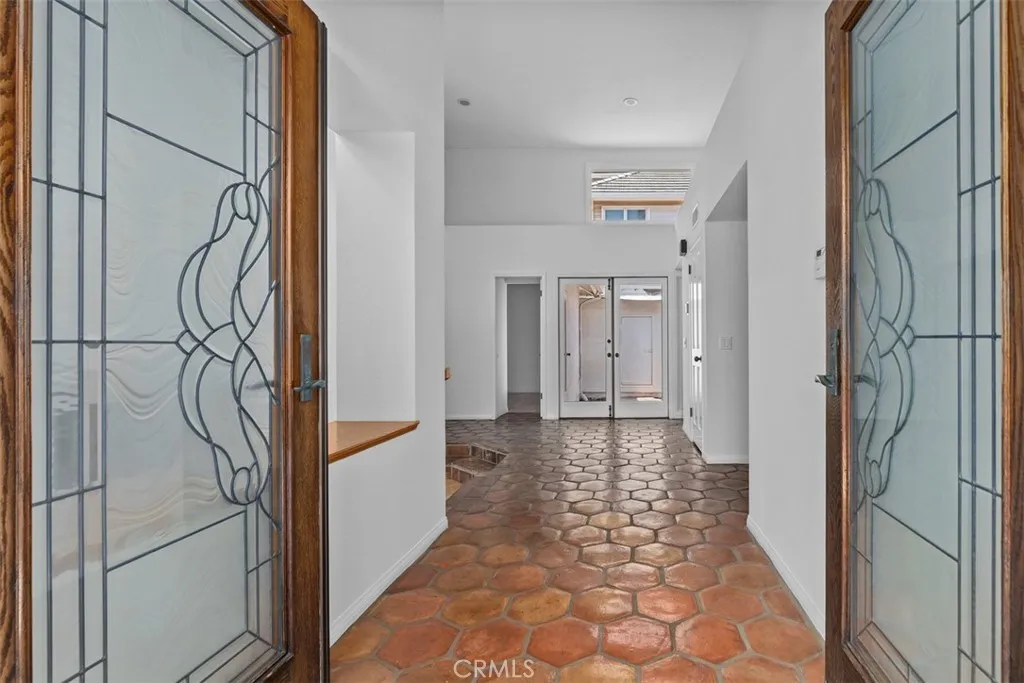 Formal entrance with vaulted ceilings.