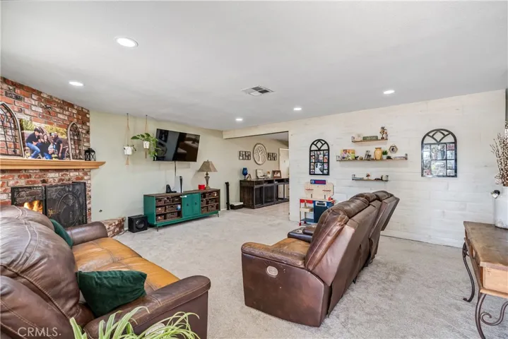 virtually staged/altered with flames in fireplace