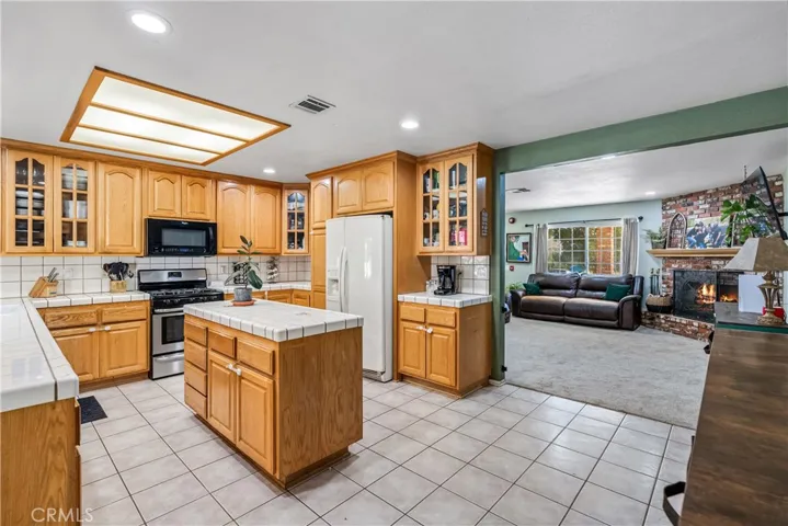 virtually staged/altered with flames in fireplace