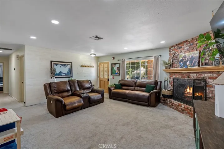 virtually staged/altered with flames in fireplace