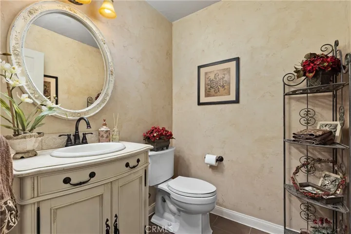 Charming French Provincial inspired bathroom on the main level of the home