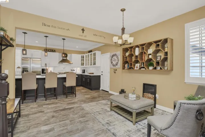Open-concept living space featuring wood-finish flooring